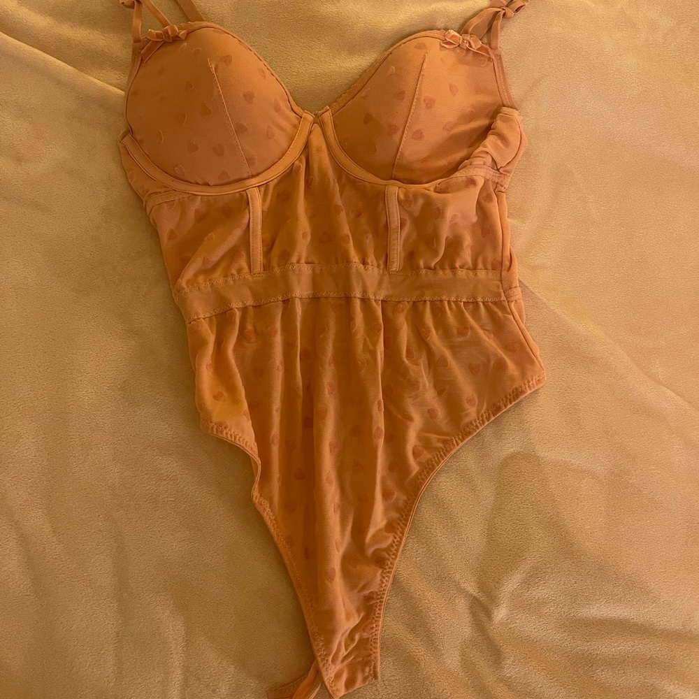 Pink thong body suit with velvet hearts